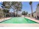 Community swimming pool with clear water, surrounded by trees, lounge chairs and tables for outdoor enjoyment at 5516 Orchard Ln # 0, Las Vegas, NV 89110