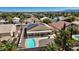 Aerial view of a single-Gathering home with a backyard pool and desert landscaping, featuring solar panels at 5812 Spinnaker Reach Ave, Las Vegas, NV 89130