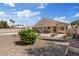 Large backyard with desert landscaping, patio, and views of the home at 5812 Spinnaker Reach Ave, Las Vegas, NV 89130