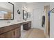 Bright bathroom featuring double sinks, vanities, and tiled floors at 5812 Spinnaker Reach Ave, Las Vegas, NV 89130