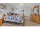 Bright bedroom featuring hardwood floors and a ceiling fan at 5812 Spinnaker Reach Ave, Las Vegas, NV 89130