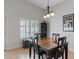 Light and airy dining room features neutral walls, plantation shutters, and tile flooring at 5812 Spinnaker Reach Ave, Las Vegas, NV 89130