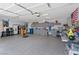 Spacious garage with epoxy flooring, cabinets, and ample storage at 5812 Spinnaker Reach Ave, Las Vegas, NV 89130