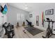 Home gym featuring hardwood floors, free weights, and exercise equipment at 5812 Spinnaker Reach Ave, Las Vegas, NV 89130