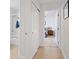 Bright hallway featuring tiled floors and view into the main bedroom at 5812 Spinnaker Reach Ave, Las Vegas, NV 89130