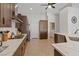 Kitchen featuring quartz countertops, stainless steel appliances, and tile flooring at 5812 Spinnaker Reach Ave, Las Vegas, NV 89130