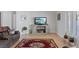 Comfortable living room with tile floors, neutral decor, and entertainment center at 5812 Spinnaker Reach Ave, Las Vegas, NV 89130