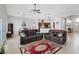 Open living room featuring neutral walls, tile floors, ceiling fans and comfortable seating at 5812 Spinnaker Reach Ave, Las Vegas, NV 89130