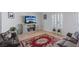 Cozy living room featuring a decorative rug, comfortable seating, and neutral walls at 5812 Spinnaker Reach Ave, Las Vegas, NV 89130