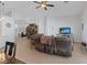 Spacious living room featuring a ceiling fan, TV and views to other rooms at 5812 Spinnaker Reach Ave, Las Vegas, NV 89130