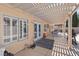 Covered patio with outdoor seating and mature landscaping at 5812 Spinnaker Reach Ave, Las Vegas, NV 89130
