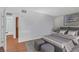 Bedroom featuring neutral decor, hardwood floors, and an ensuite bathroom at 595 S Royal Crest Cir # 24, Las Vegas, NV 89169