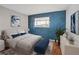 Bedroom showcasing a stylish accent wall, hardwood floors, and contemporary decor at 595 S Royal Crest Cir # 24, Las Vegas, NV 89169