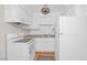 Functional kitchen featuring white appliances and a laminate countertop at 595 S Royal Crest Cir # 24, Las Vegas, NV 89169