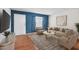 Cozy living room featuring stylish furniture and a modern geometric accent wall at 595 S Royal Crest Cir # 24, Las Vegas, NV 89169
