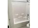 Clean, white bathroom with a bathtub and shower combination at 6450 Spring Jog St, Las Vegas, NV 89166