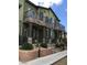 Beautiful townhome with stone accents, private balconies, and manicured landscaping at 6450 Spring Jog St, Las Vegas, NV 89166