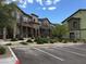 Charming townhomes with stone accents, balconies, manicured landscaping and convenient parking spaces at 6450 Spring Jog St, Las Vegas, NV 89166