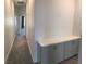 Bright hallway features built-in cabinetry, providing ample storage and a clean transition between spaces at 6450 Spring Jog St, Las Vegas, NV 89166