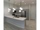 Well-equipped kitchen with stainless steel appliances, white countertops, and pendant lighting at 6450 Spring Jog St, Las Vegas, NV 89166