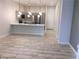 Modern kitchen featuring stainless steel appliances, quartz countertops, and stylish lighting at 6450 Spring Jog St, Las Vegas, NV 89166