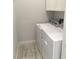 Functional laundry area with white appliances, providing convenience and efficiency for household chores at 6450 Spring Jog St, Las Vegas, NV 89166