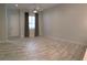View of the open living space, with large windows and stylish flooring that enhances the natural light at 6450 Spring Jog St, Las Vegas, NV 89166