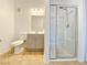 Bathroom featuring tiled floor, toilet, vanity with sink, shower with glass doors at 6635 Flaminian Ln # 104, North Las Vegas, NV 89084