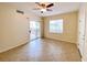 Bedroom with large windows, closet, and access to a balcony with sliding glass doors at 6635 Flaminian Ln # 104, North Las Vegas, NV 89084