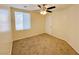 Neutral bedroom with large window for natural light and carpeted floors at 6635 Flaminian Ln # 104, North Las Vegas, NV 89084