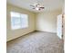 Neutral bedroom with large window for natural light and carpeted floors at 6635 Flaminian Ln # 104, North Las Vegas, NV 89084