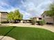 Well-maintained apartment community grounds featuring green turf, a covered picnic area, and tidy landscaping at 6635 Flaminian Ln # 104, North Las Vegas, NV 89084