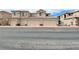 Well-maintained condo building with multiple garages and neutral color scheme at 6635 Flaminian Ln # 104, North Las Vegas, NV 89084