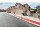 Exterior of building with 2-car garages and mailboxes at 6635 Flaminian Ln # 104, North Las Vegas, NV 89084