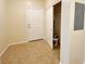 Hallway featuring tile flooring, and a closet at 6635 Flaminian Ln # 104, North Las Vegas, NV 89084