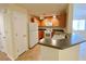 Functional kitchen features matching appliances, wood cabinets and breakfast bar seating at 6635 Flaminian Ln # 104, North Las Vegas, NV 89084