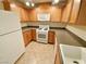 Updated kitchen with sleek countertops, and efficient layout maximizing space and functionality at 6635 Flaminian Ln # 104, North Las Vegas, NV 89084
