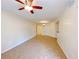 Open living space with neutral walls, tile flooring, ceiling fan, and recessed lighting at 6635 Flaminian Ln # 104, North Las Vegas, NV 89084
