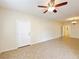 Open-concept living room showcasing neutral paint, tile flooring, and abundant natural light at 6635 Flaminian Ln # 104, North Las Vegas, NV 89084
