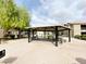 Shaded community picnic area with tables, set amongst well-maintained landscaping at 6635 Flaminian Ln # 104, North Las Vegas, NV 89084