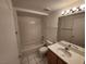 Cozy bathroom features a shower-tub combo, single sink with vanity, and a tiled floor at 6908 Dorita Ave # 101, Las Vegas, NV 89108