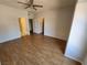 Spacious bedroom with hardwood flooring, neutral paint, and an ensuite bathroom at 6908 Dorita Ave # 101, Las Vegas, NV 89108