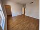 Spacious bedroom with laminate wood flooring and access to closet space at 6908 Dorita Ave # 101, Las Vegas, NV 89108