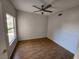 Bright bedroom with wood-look flooring and ceiling fan at 6908 Dorita Ave # 101, Las Vegas, NV 89108