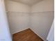 Simple walk-in closet with laminate floors and wire shelving at 6908 Dorita Ave # 101, Las Vegas, NV 89108