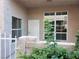 Inviting entrance to home with security door and decorative garden at 6908 Dorita Ave # 101, Las Vegas, NV 89108