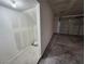 Interior view of a clean and unfinished two-car garage with storage space at 6908 Dorita Ave # 101, Las Vegas, NV 89108