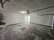 Spacious and unfinished two-car garage with lighting at 6908 Dorita Ave # 101, Las Vegas, NV 89108