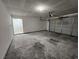 A spacious two-car garage with high ceilings provides ample space for parking and storage at 6908 Dorita Ave # 101, Las Vegas, NV 89108