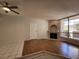 Living room features tile and laminate flooring, fireplace and window at 6908 Dorita Ave # 101, Las Vegas, NV 89108